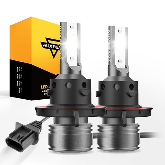 Pair of H13 LED light bulbs with fanless design and bright 6500K white light next to yellow and black packaging box